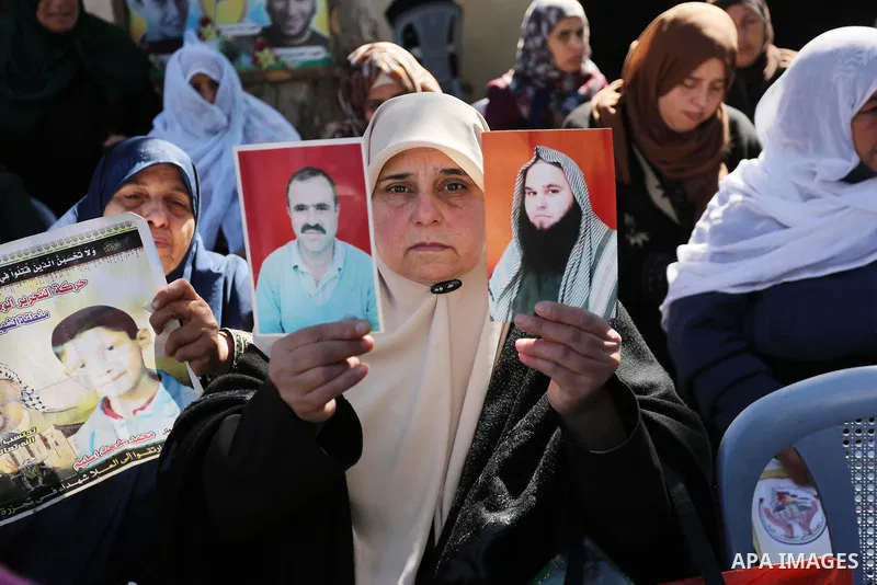 Palestinian families of martyrs take part a protest to demand their rights and salaries, in Gaza city, on February 21, 2017. Photo by Ashraf Amra