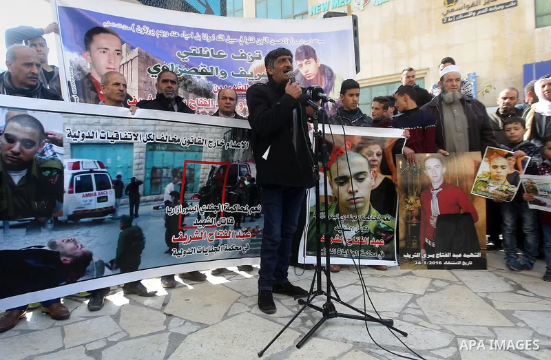 Palestinians take part in a demonstration following a verdict in the trial of the Israeli soldier Elor Azaria who in March 2016 shot dead wounded alleged Palestinian assailant Abdul Fatah al-Sharif as he lay on the groun...