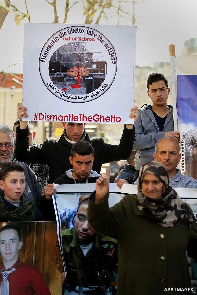 Palestinians take part in a demonstration following a verdict in the trial of the Israeli soldier Elor Azaria who in March 2016 shot dead wounded alleged Palestinian assailant Abdul Fatah al-Sharif as he lay on the groun...