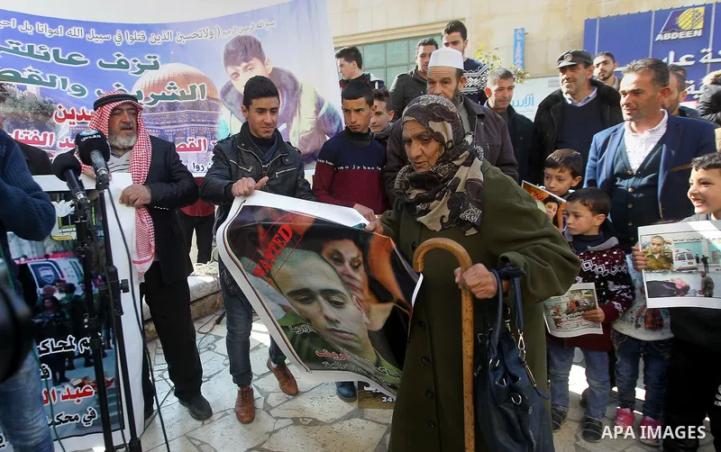 A Palestinian woman reacts during a demonstration following a verdict in the trial of the Israeli soldier Elor Azaria who in March 2016 shot dead wounded alleged Palestinian assailant Abdul Fatah al-Sharif as he lay on t...