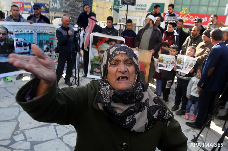A Palestinian woman reacts during a demonstration following a verdict in the trial of the Israeli soldier Elor Azaria who in March 2016 shot dead wounded alleged Palestinian assailant Abdul Fatah al-Sharif as he lay on t...