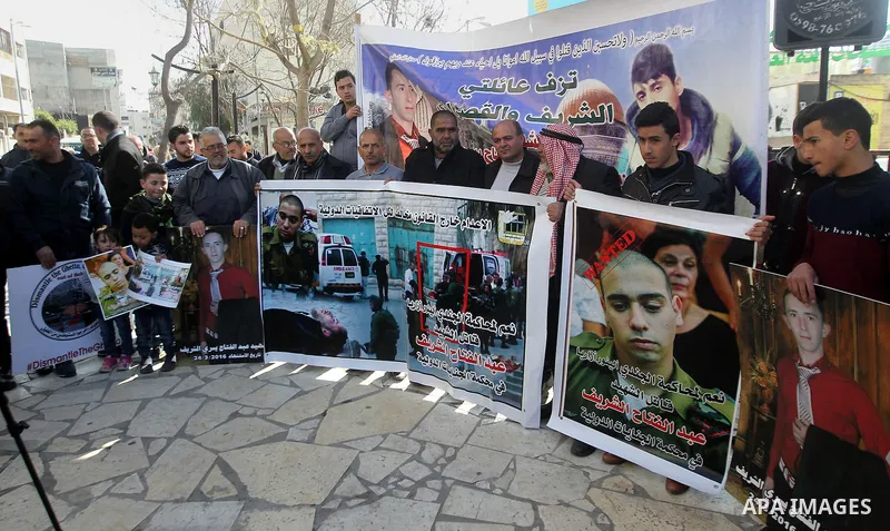Palestinians take part in a demonstration following a verdict in the trial of the Israeli soldier Elor Azaria who in March 2016 shot dead wounded alleged Palestinian assailant Abdul Fatah al-Sharif as he lay on the groun...