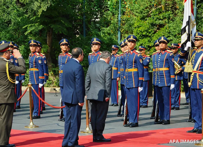 A handout picture released by the Jordanian Royal Palace on February 21, 2017, shows Jordan's King Abdullah II (C) reviewing the honour guard alongside Egyptian President Abdel Fattah al-Sisi during a meeting in Cairo. P...