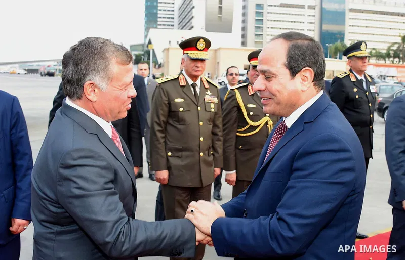 A handout picture released by the Jordanian Royal Palace on February 21, 2017, shows Jordan's King Abdullah II shaking hands with Egyptian President Abdel Fattah al-Sisi during a meeting in Cairo. Photo by Egyptian Presi...