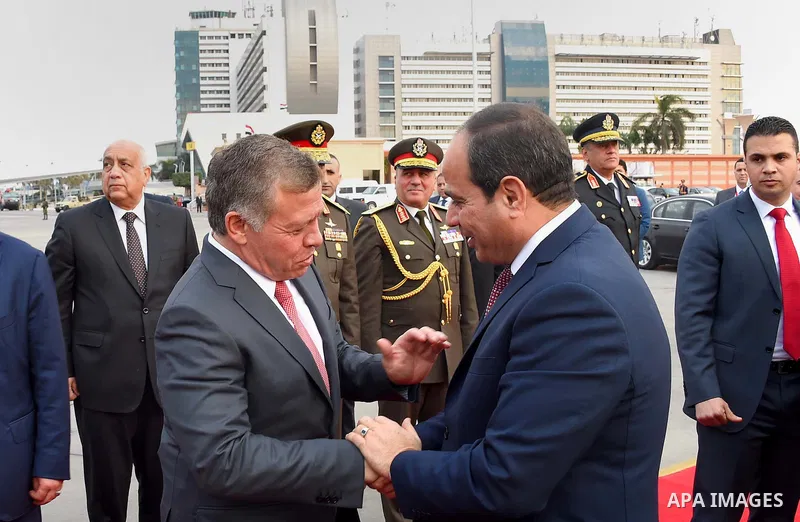 A handout picture released by the Jordanian Royal Palace on February 21, 2017, shows Jordan's King Abdullah II shaking hands with Egyptian President Abdel Fattah al-Sisi during a meeting in Cairo. Photo by Egyptian Presi...
