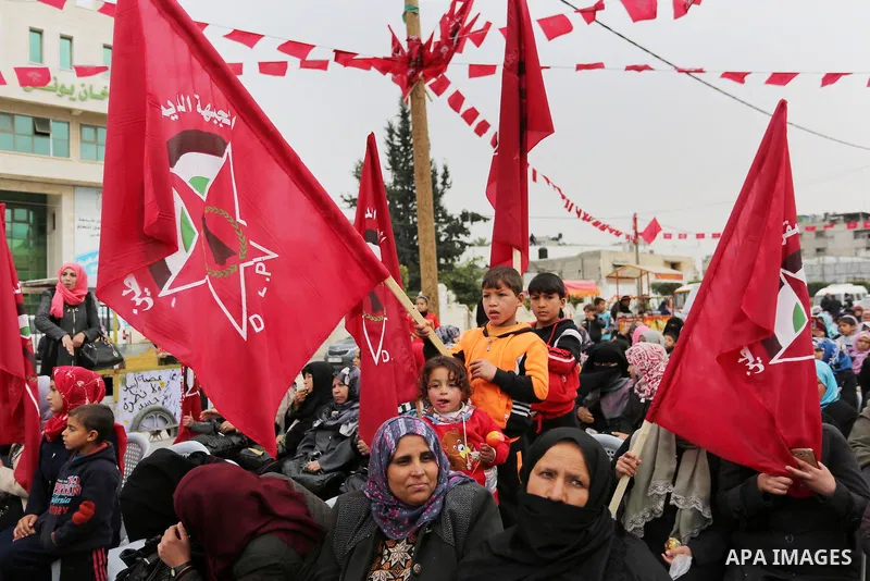Palestinian supporters of the Democratic Front for the Liberation of Palestine (DFLP) take part in a rally marking the 48th anniversary of DFLP foundation, in Khan younis in the the southern Gaza strip on February 22, 20...