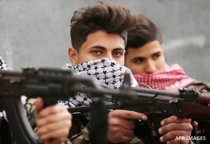 Palestinian supporters of the Democratic Front for the Liberation of Palestine (DFLP) take part in a rally marking the 48th anniversary of DFLP foundation, in Khan younis in the the southern Gaza strip on February 22, 20...
