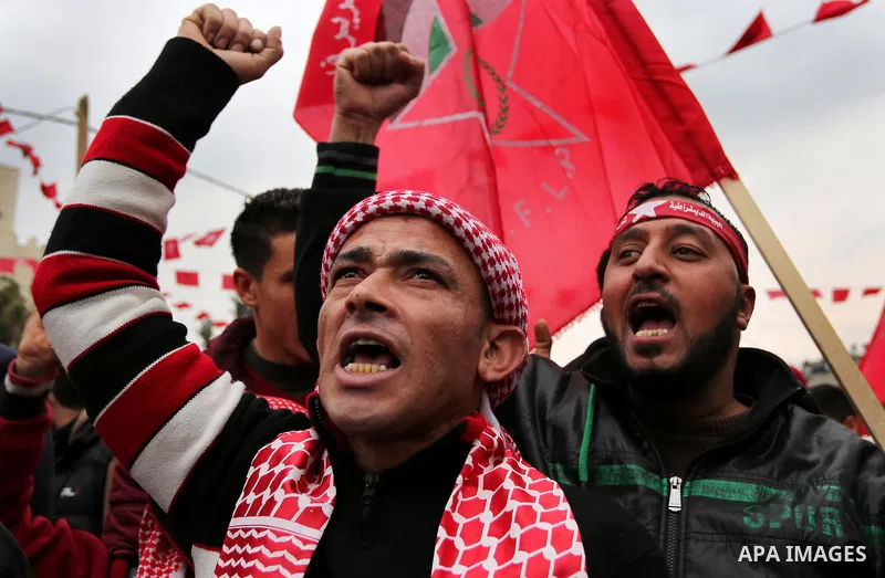 Palestinian supporters of the Democratic Front for the Liberation of Palestine (DFLP) take part in a rally marking the 48th anniversary of DFLP foundation, in Khan younis in the the southern Gaza strip on February 22, 20...