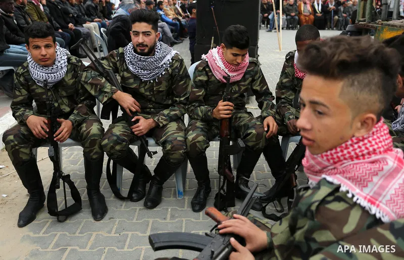 Palestinian supporters of the Democratic Front for the Liberation of Palestine (DFLP) take part in a rally marking the 48th anniversary of DFLP foundation, in Khan younis in the the southern Gaza strip on February 22, 20...