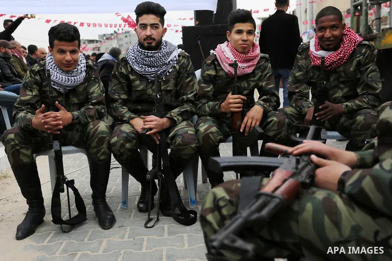 Palestinian supporters of the Democratic Front for the Liberation of Palestine (DFLP) take part in a rally marking the 48th anniversary of DFLP foundation, in Khan younis in the the southern Gaza strip on February 22, 20...