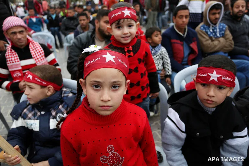 Palestinian supporters of the Democratic Front for the Liberation of Palestine (DFLP) take part in a rally marking the 48th anniversary of DFLP foundation, in Khan younis in the the southern Gaza strip on February 22, 20...