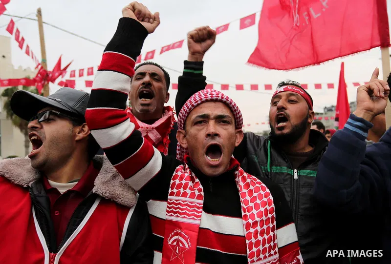 Palestinian supporters of the Democratic Front for the Liberation of Palestine (DFLP) take part in a rally marking the 48th anniversary of DFLP foundation, in Khan younis in the the southern Gaza strip on February 22, 20...
