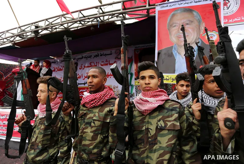 Palestinian supporters of the Democratic Front for the Liberation of Palestine (DFLP) take part in a rally marking the 48th anniversary of DFLP foundation, in Khan younis in the the southern Gaza strip on February 22, 20...