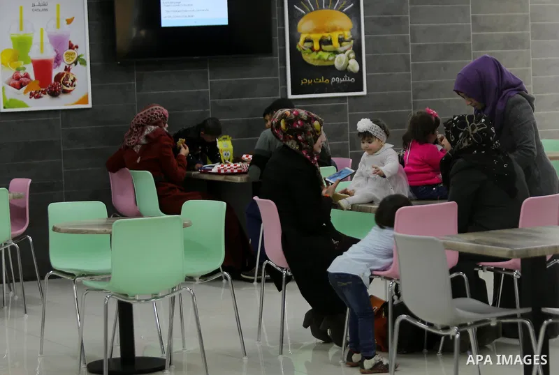 Palestinians shop in a new indoor shopping mall in the Gaza Strip, on February 23, 2017. In a welcome sign of normalcy, the first-of-its-kind indoor shopping mall -- complete with an international retail chain, three-sto...