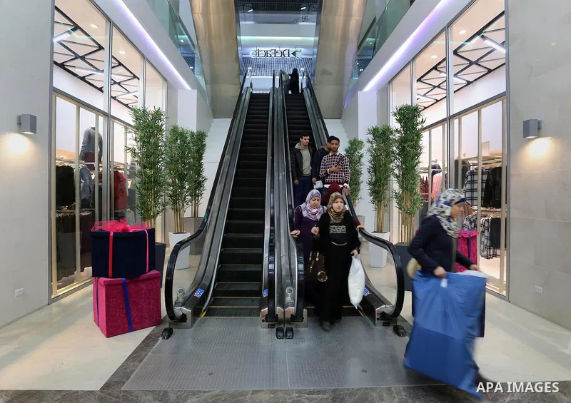 Palestinians shop in a new indoor shopping mall in the Gaza Strip, on February 23, 2017. In a welcome sign of normalcy, the first-of-its-kind indoor shopping mall -- complete with an international retail chain, three-sto...