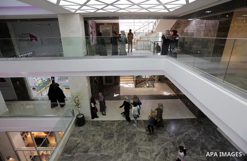 Palestinians shop in a new indoor shopping mall in the Gaza Strip, on February 23, 2017. In a welcome sign of normalcy, the first-of-its-kind indoor shopping mall -- complete with an international retail chain, three-sto...