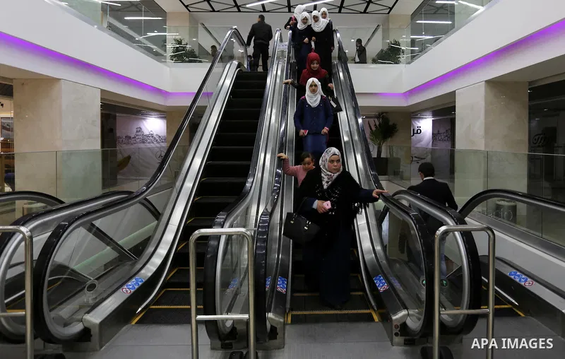 Palestinians shop in a new indoor shopping mall in the Gaza Strip, on February 23, 2017. In a welcome sign of normalcy, the first-of-its-kind indoor shopping mall -- complete with an international retail chain, three-sto...