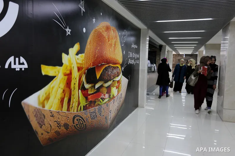 Palestinians shop in a new indoor shopping mall in the Gaza Strip, on February 23, 2017. In a welcome sign of normalcy, the first-of-its-kind indoor shopping mall -- complete with an international retail chain, three-sto...