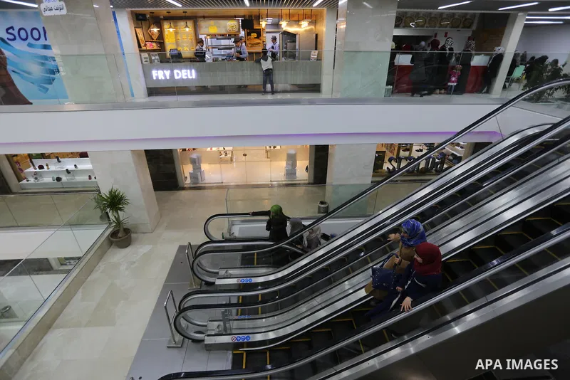 Palestinians shop in a new indoor shopping mall in the Gaza Strip, on February 23, 2017. In a welcome sign of normalcy, the first-of-its-kind indoor shopping mall -- complete with an international retail chain, three-sto...