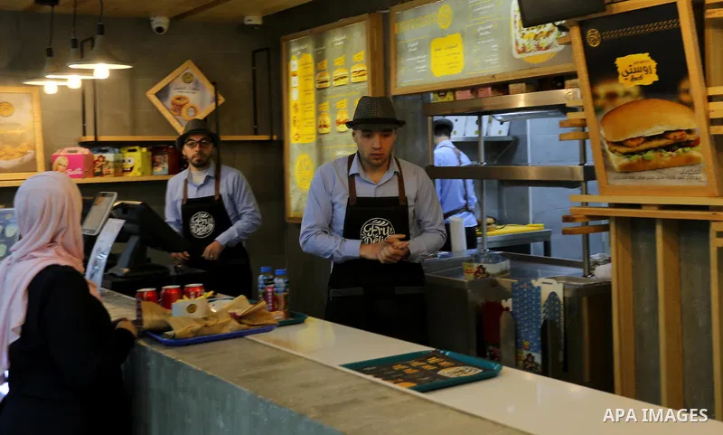 Palestinians shop in a new indoor shopping mall in the Gaza Strip, on February 23, 2017. In a welcome sign of normalcy, the first-of-its-kind indoor shopping mall -- complete with an international retail chain, three-sto...