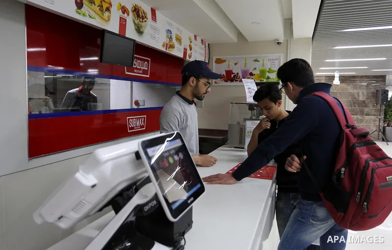 Palestinians shop in a new indoor shopping mall in the Gaza Strip, on February 23, 2017. In a welcome sign of normalcy, the first-of-its-kind indoor shopping mall -- complete with an international retail chain, three-sto...