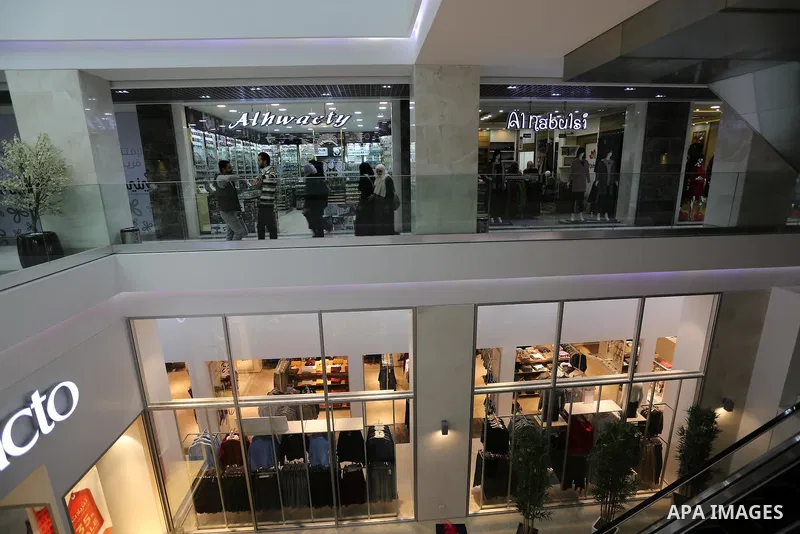 Palestinians shop in a new indoor shopping mall in the Gaza Strip, on February 23, 2017. In a welcome sign of normalcy, the first-of-its-kind indoor shopping mall -- complete with an international retail chain, three-sto...