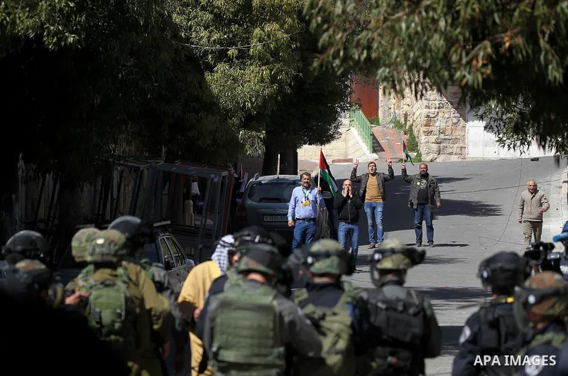 Palestinian and foreign protesters demonstrate, calling for the opening of Shuhada Street, which is largely closed off to Palestinians, in the West Bank city of Hebron, coinciding with the anniversary of a 1994 massacre...