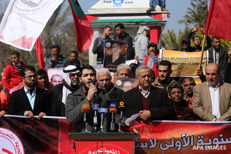 Palestinian supporters of the Popular Front for the Liberation of Palestine (PFLP), take part during a protest marking the first Anniversary of death of Palestinian Omar El-Nayef who was assassinated in Palestinian embas...