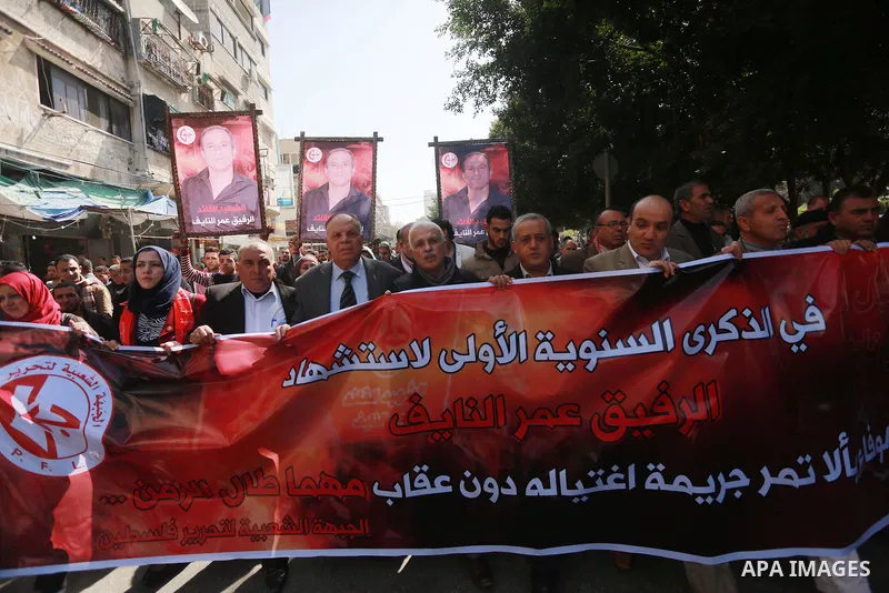 Palestinian supporters of the Popular Front for the Liberation of Palestine (PFLP), take part during a protest marking the first Anniversary of death of Palestinian Omar El-Nayef who was assassinated in Palestinian embas...