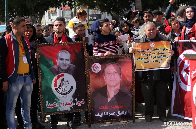 Palestinian supporters of the Popular Front for the Liberation of Palestine (PFLP), take part during a protest marking the first Anniversary of death of Palestinian Omar El-Nayef who was assassinated in Palestinian embas...