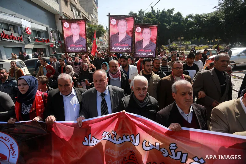 Palestinian supporters of the Popular Front for the Liberation of Palestine (PFLP), take part during a protest marking the first Anniversary of death of Palestinian Omar El-Nayef who was assassinated in Palestinian embas...