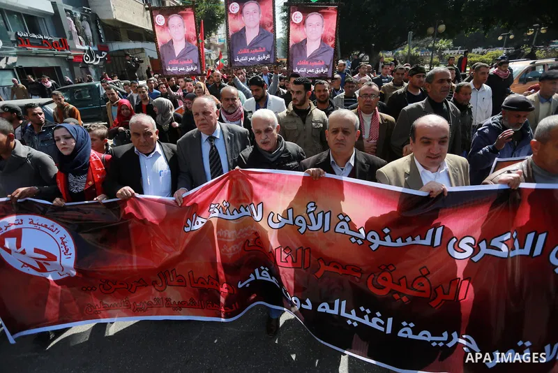 Palestinian supporters of the Popular Front for the Liberation of Palestine (PFLP), take part during a protest marking the first Anniversary of death of Palestinian Omar El-Nayef who was assassinated in Palestinian embas...