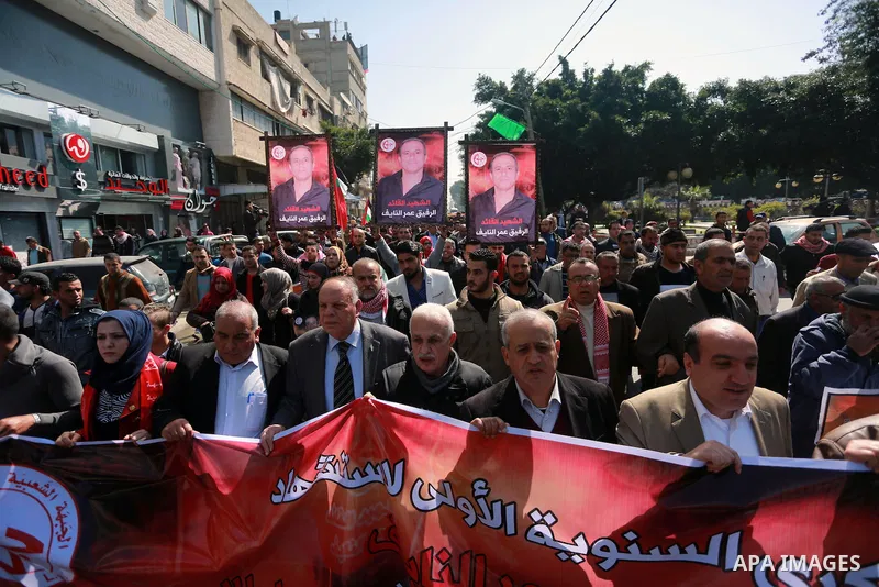 Palestinian supporters of the Popular Front for the Liberation of Palestine (PFLP), take part during a protest marking the first Anniversary of death of Palestinian Omar El-Nayef who was assassinated in Palestinian embas...