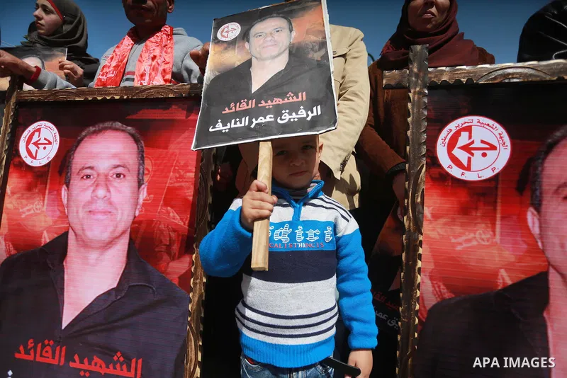 Palestinian supporters of the Popular Front for the Liberation of Palestine (PFLP), take part during a protest marking the first Anniversary of death of Palestinian Omar El-Nayef who was assassinated in Palestinian embas...