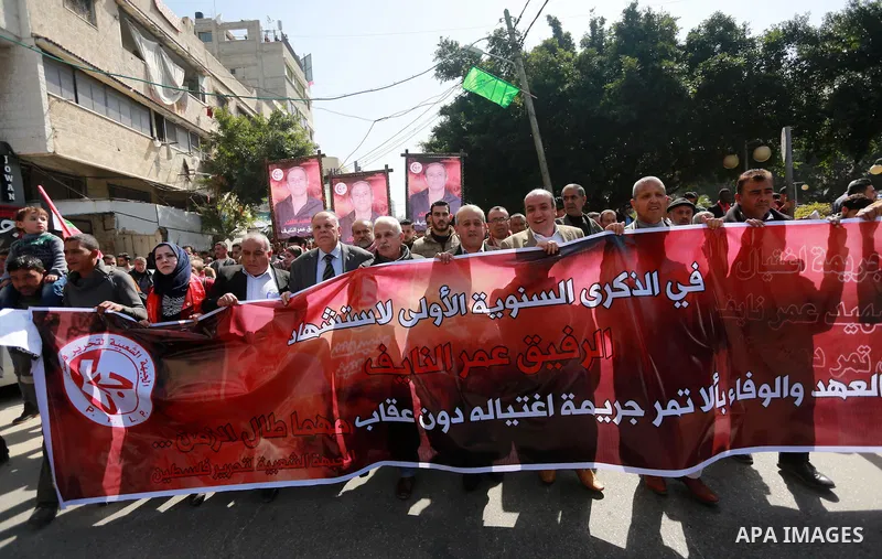 Palestinian supporters of the Popular Front for the Liberation of Palestine (PFLP), take part during a protest marking the first Anniversary of death of Palestinian Omar El-Nayef who was assassinated in Palestinian embas...