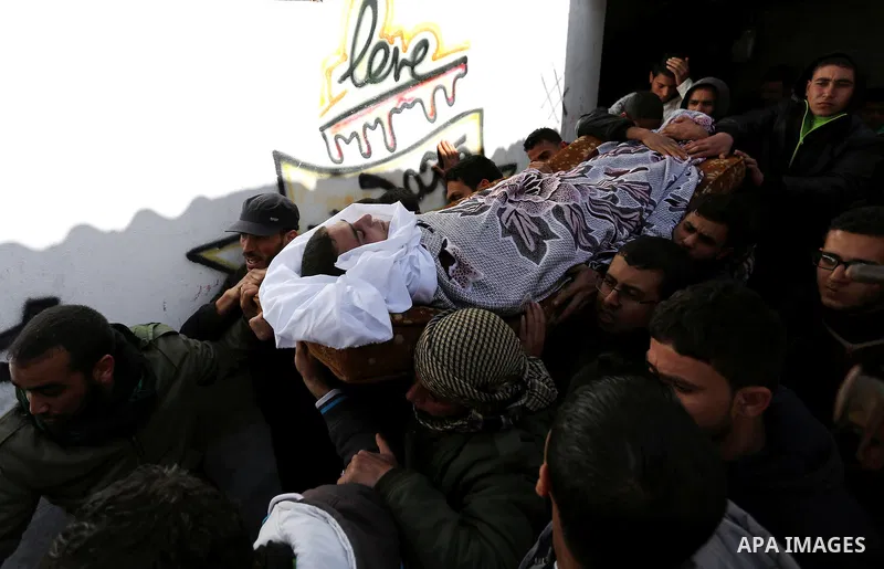 Palestinians carry the body of Palestinian Abdullah Alnamula, 23, who died after inhaling toxic gas inside the tunnel along the border between the Gaza Strip and Egypt during his funeral in Rafah in the southern Gaza str...