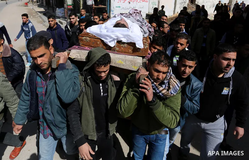 Palestinians carry the body of Palestinian Abdullah Alnamula, 23, who died after inhaling toxic gas inside the tunnel along the border between the Gaza Strip and Egypt during his funeral in Rafah in the southern Gaza str...