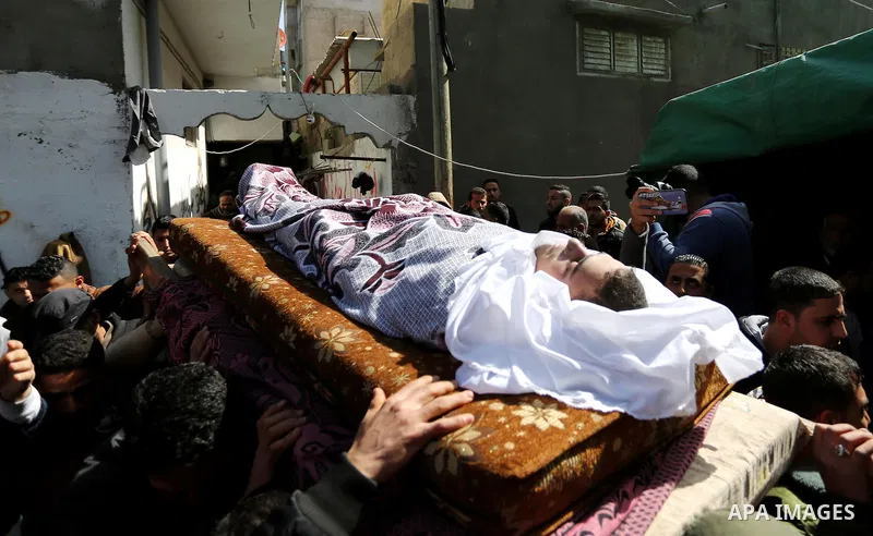 Palestinians carry the body of Palestinian Abdullah Alnamula, 23, who died after inhaling toxic gas inside the tunnel along the border between the Gaza Strip and Egypt during his funeral in Rafah in the southern Gaza str...