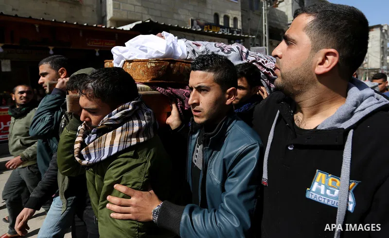 Palestinians carry the body of Palestinian Abdullah Alnamula, 23, who died after inhaling toxic gas inside the tunnel along the border between the Gaza Strip and Egypt during his funeral in Rafah in the southern Gaza str...