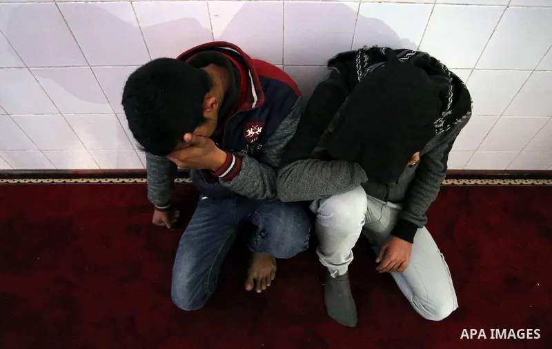 Palestinians mourn during the funeral of Obeid Soufi, 25, who died after inhaling toxic gas inside the tunnel along the border between the Gaza Strip and Egypt in Rafah in the southern Gaza strip, on February 25, 2017. T...