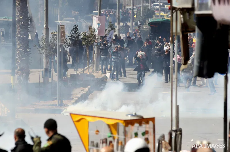 Members of the Palestinian security forces clash with demonstrators during a protest organised by Hizb-ut Tahrir against what organisers say are political arrests by the Palestinian Authority in the West Bank city of Heb...