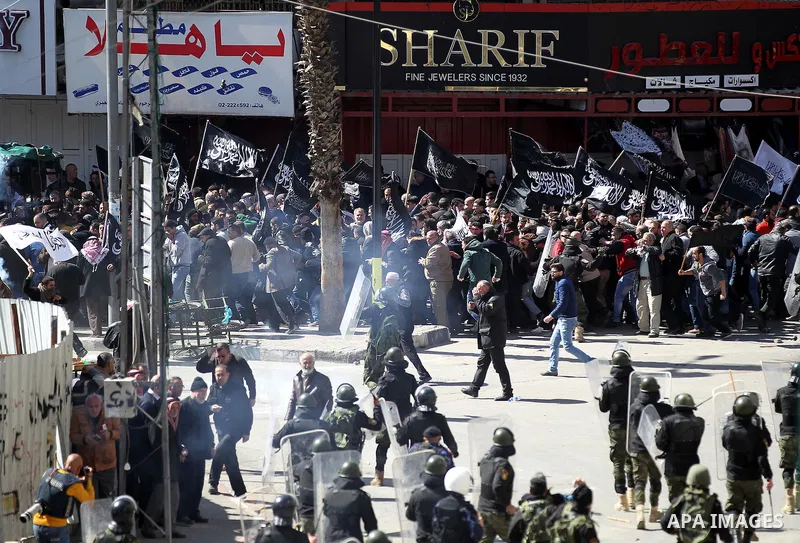 Members of the Palestinian security forces clash with demonstrators during a protest organised by Hizb-ut Tahrir against what organisers say are political arrests by the Palestinian Authority in the West Bank city of Heb...