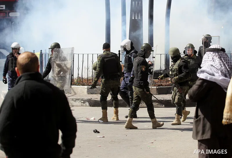 Members of the Palestinian security forces clash with demonstrators during a protest organised by Hizb-ut Tahrir against what organisers say are political arrests by the Palestinian Authority in the West Bank city of Heb...