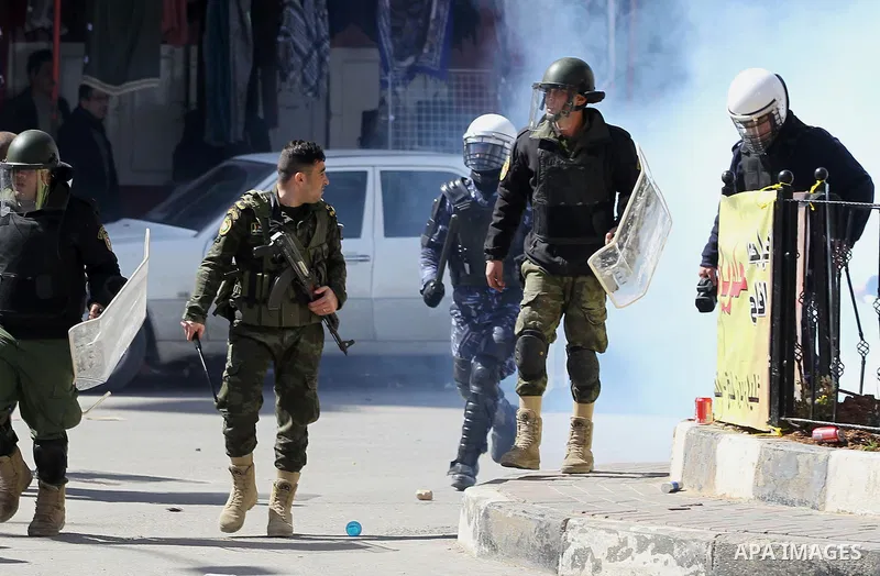 Members of the Palestinian security forces clash with demonstrators during a protest organised by Hizb-ut Tahrir against what organisers say are political arrests by the Palestinian Authority in the West Bank city of Heb...