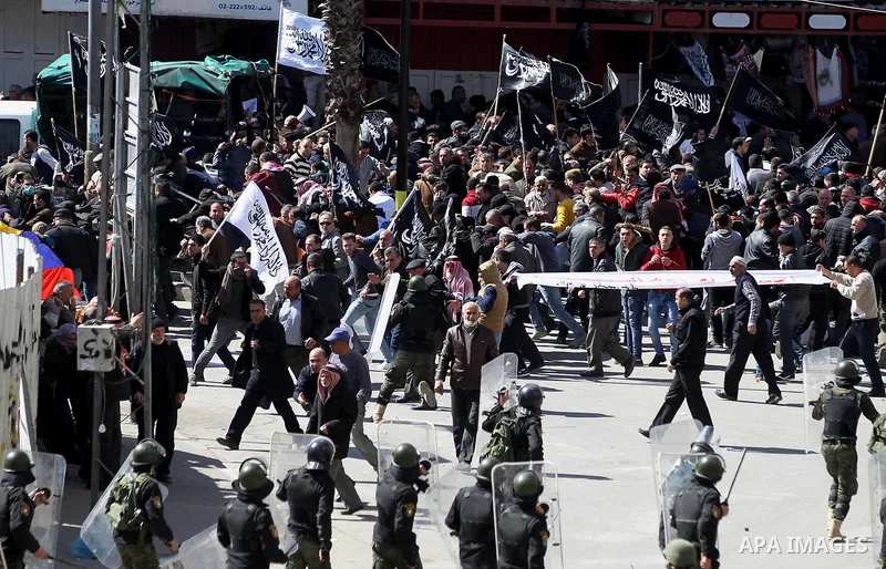 Members of the Palestinian security forces clash with demonstrators during a protest organised by Hizb-ut Tahrir against what organisers say are political arrests by the Palestinian Authority in the West Bank city of Heb...