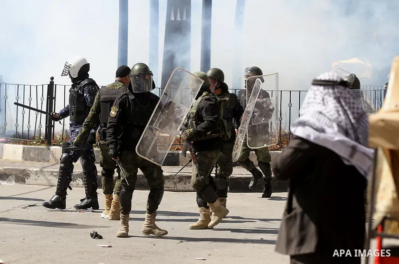 Members of the Palestinian security forces clash with demonstrators during a protest organised by Hizb-ut Tahrir against what organisers say are political arrests by the Palestinian Authority in the West Bank city of Heb...