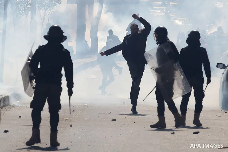 Members of the Palestinian security forces clash with demonstrators during a protest organised by Hizb-ut Tahrir against what organisers say are political arrests by the Palestinian Authority in the West Bank city of Heb...