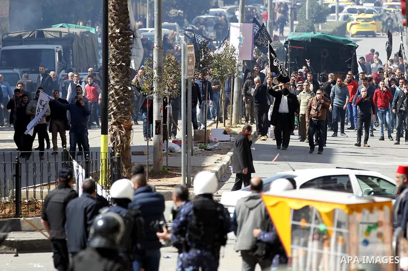 Palestinian demonstrators take part in a protest organised by Hizb-ut Tahrir against what organisers say are political arrests by the Palestinian Authority in the West Bank city of Hebron February 25, 2017. Photo by Wisa...