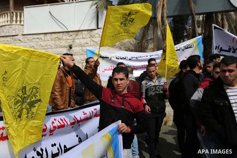 Palestinian supporters Fatah movement take part during a protest against the administrative detention, in Gaza city, on February 26, 2017. Photo by Ashraf Amra