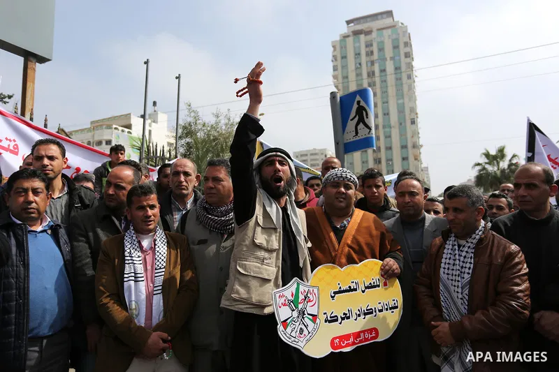 Palestinian supporters Fatah movement take part during a protest against the administrative detention, in Gaza city, on February 26, 2017. Photo by Ashraf Amra